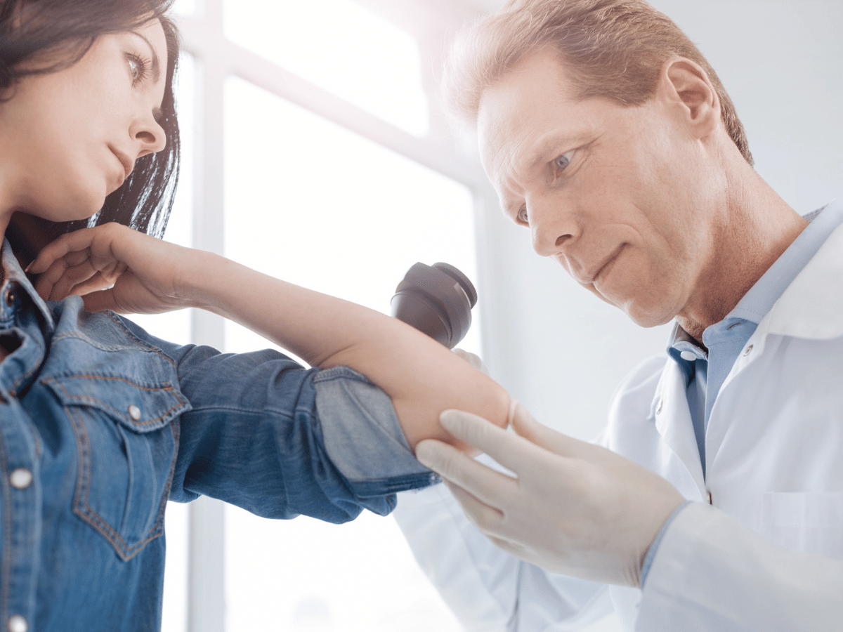 doctor looking at arm